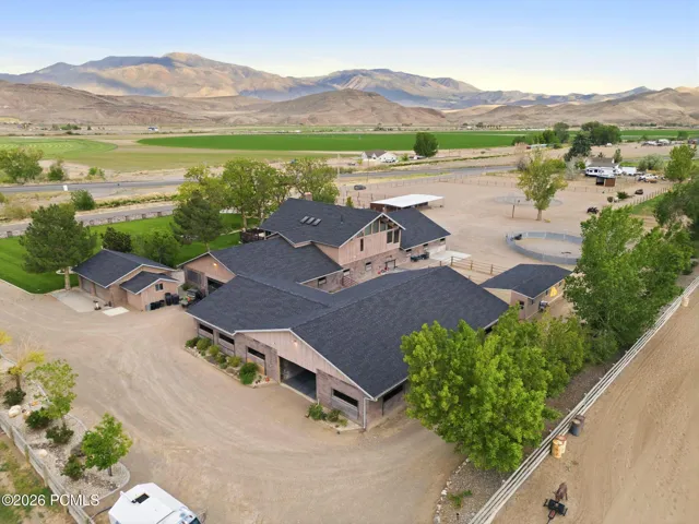 Main Residence, Main Breeding / Veterinary Barn, Stallion / Back Barn & Detached 2 Car Garage. One bay has double sided door for drive through access.