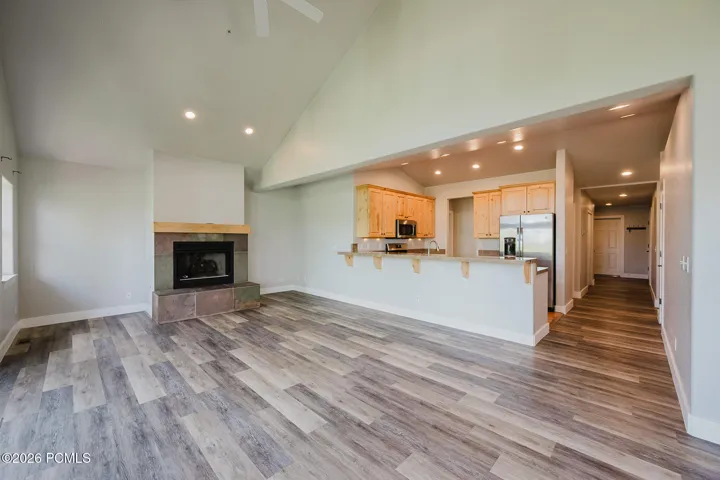 Living room and fireplace. Vaulted ceilings add comfort.