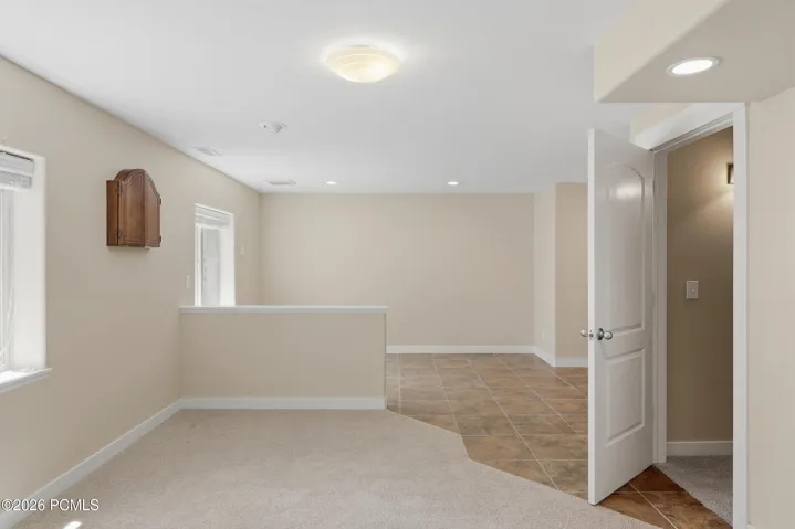 A large room used as a recreation room with a bar. It could be two bedrooms if desired.