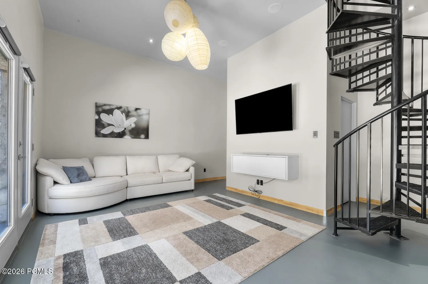 Lower level living room with Spiral Staircase