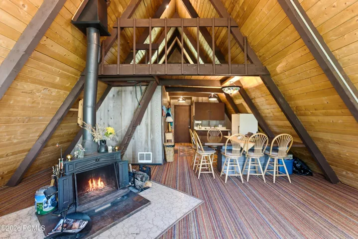 View of great room, kitchen and loft above.