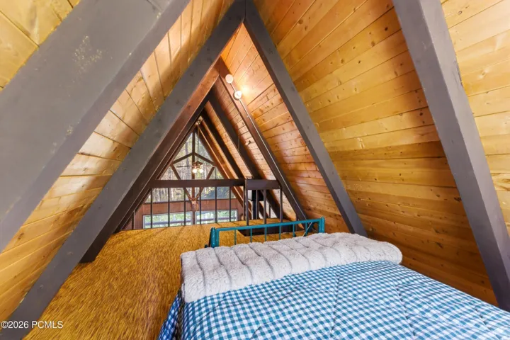 Upstairs loft with bed view.
