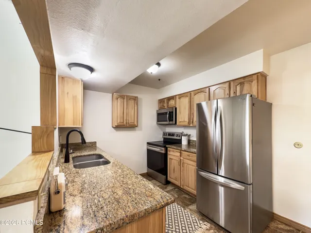Full kitchen with granite countertops