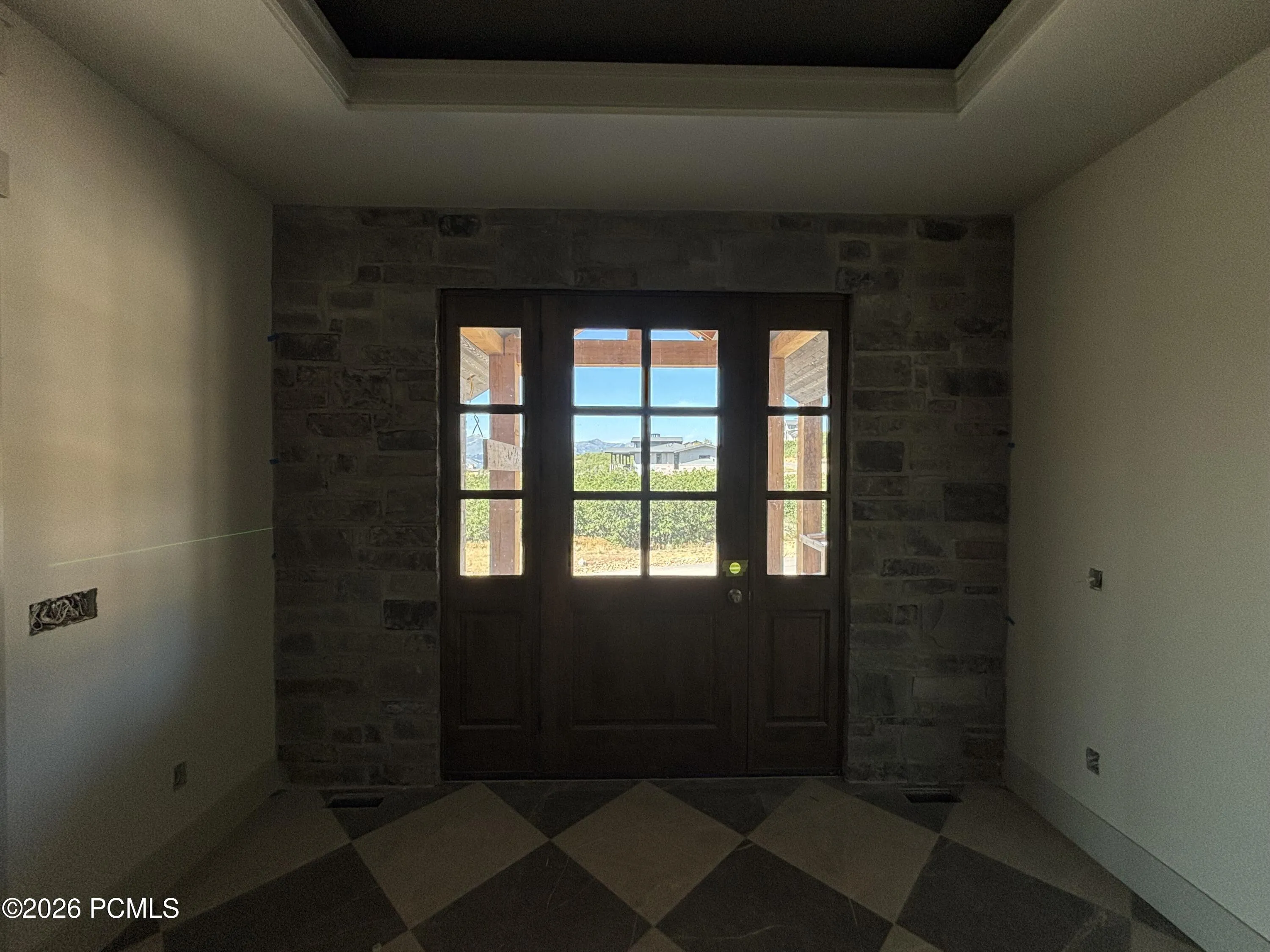 Entrance foyer featuring beautiful stone