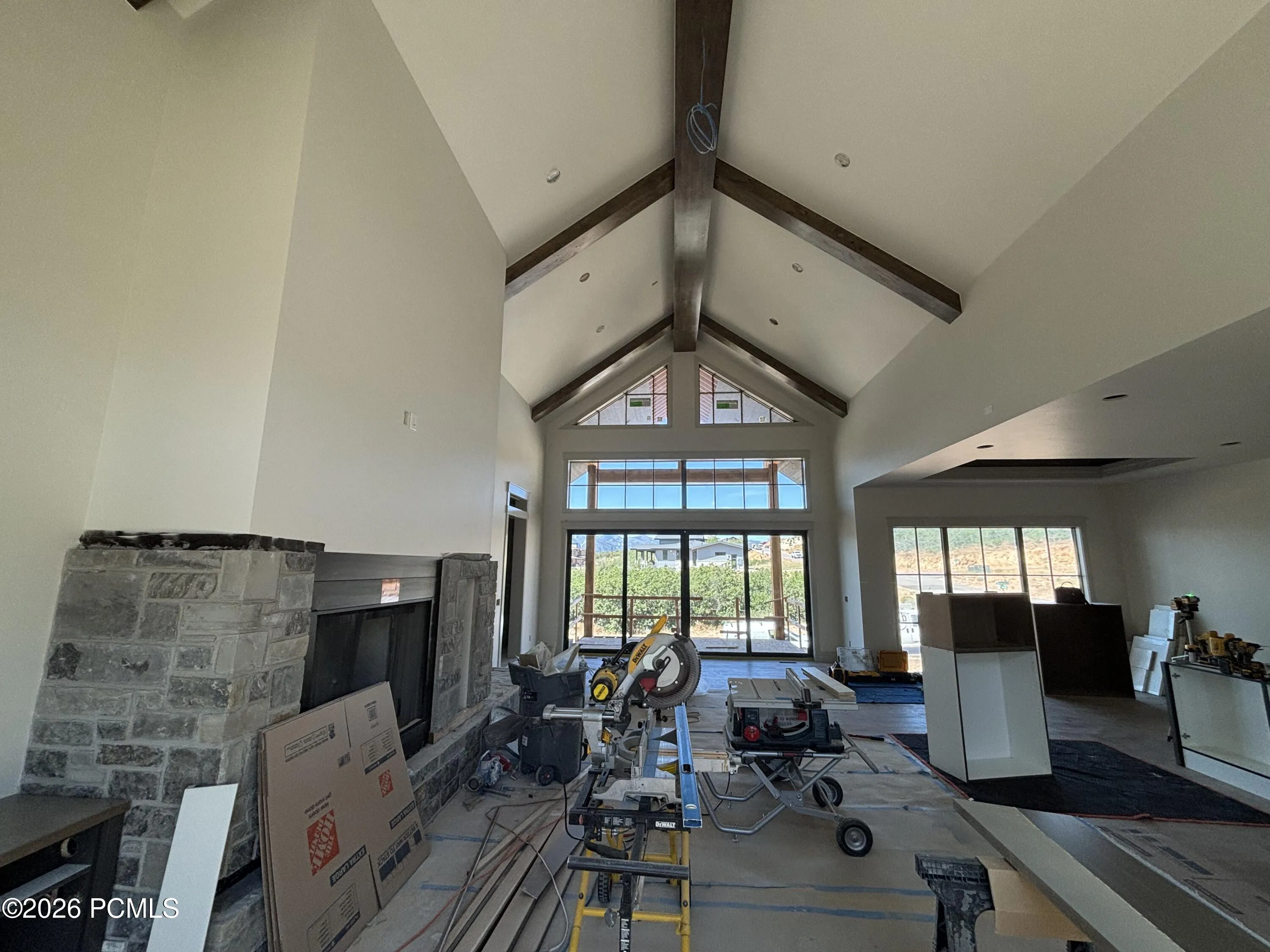 Spacious living space featuring vaulted ceilings