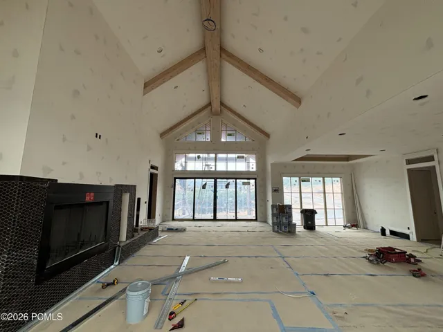 Spacious living space featuring vaulted ceilings