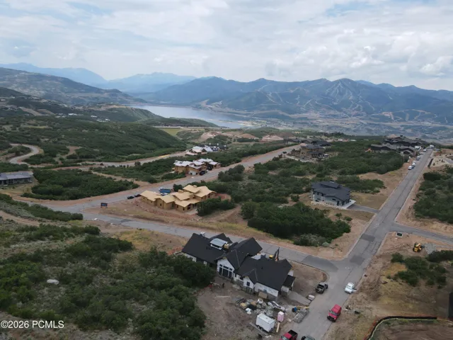 Bird's eye view above the home featuring a mountain backdrop