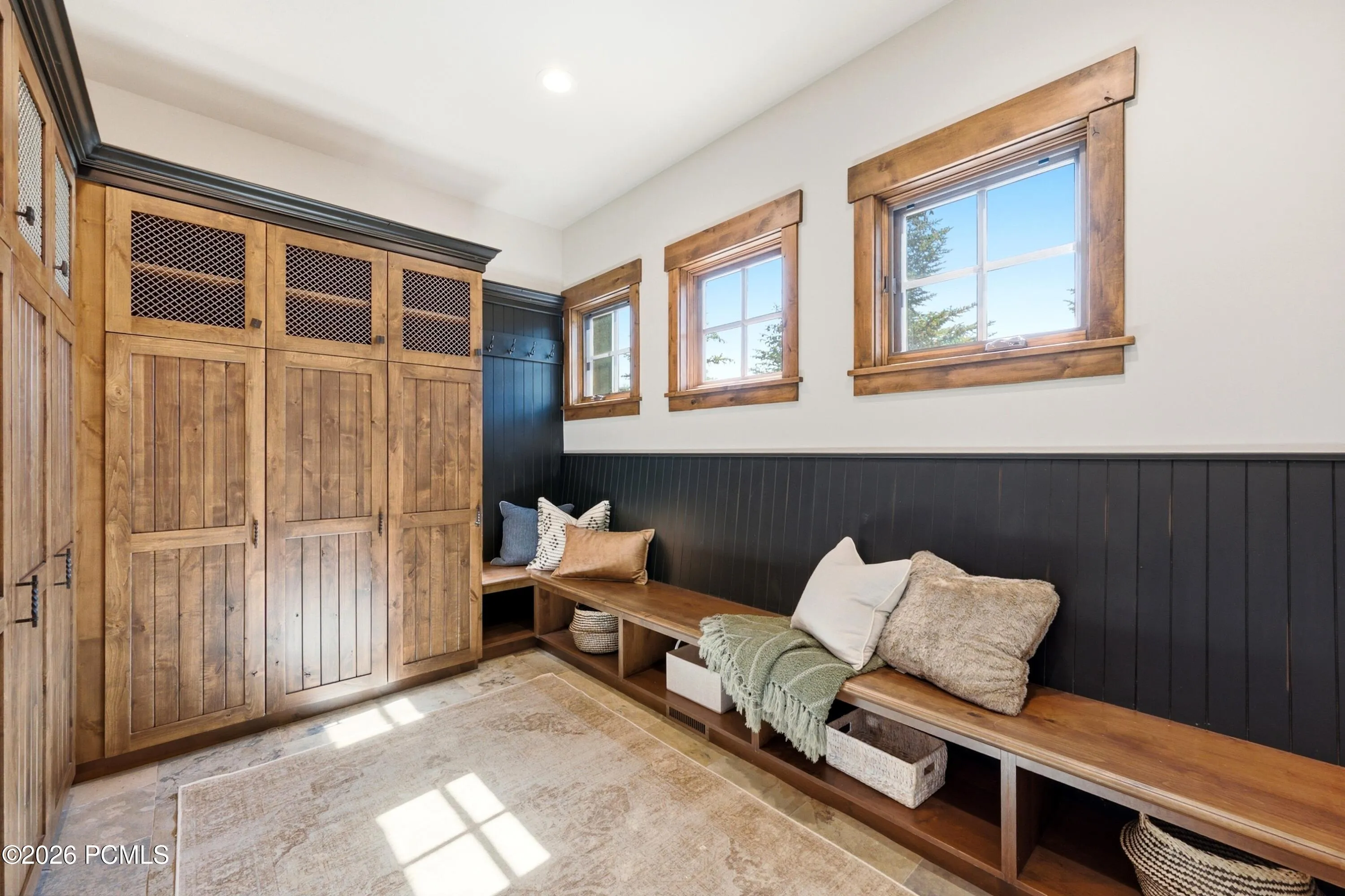 Massive Mud Room With Long Bench and Many Lockers for Storage