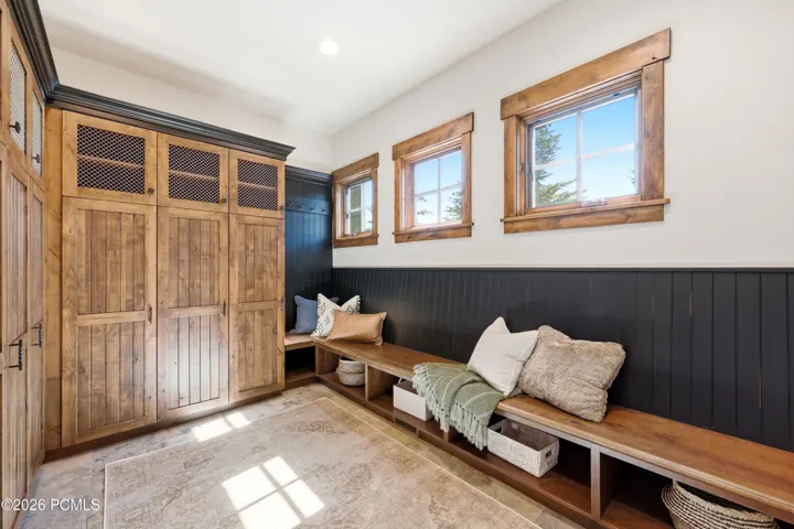 Massive Mud Room With Long Bench and Many Lockers for Storage