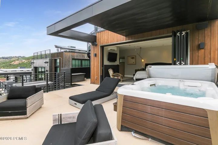 Primary bedroom deck w/hot tub