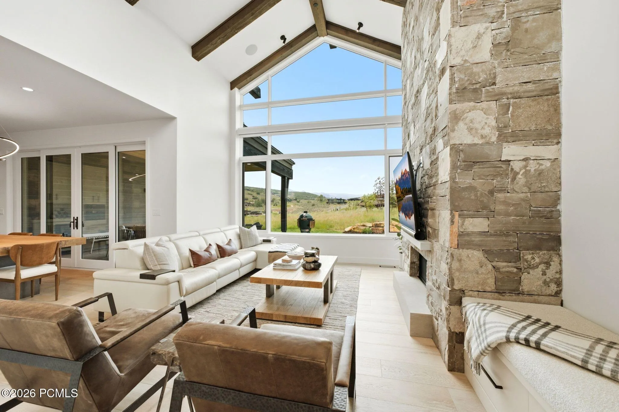 Vaulted great room with expansive windows