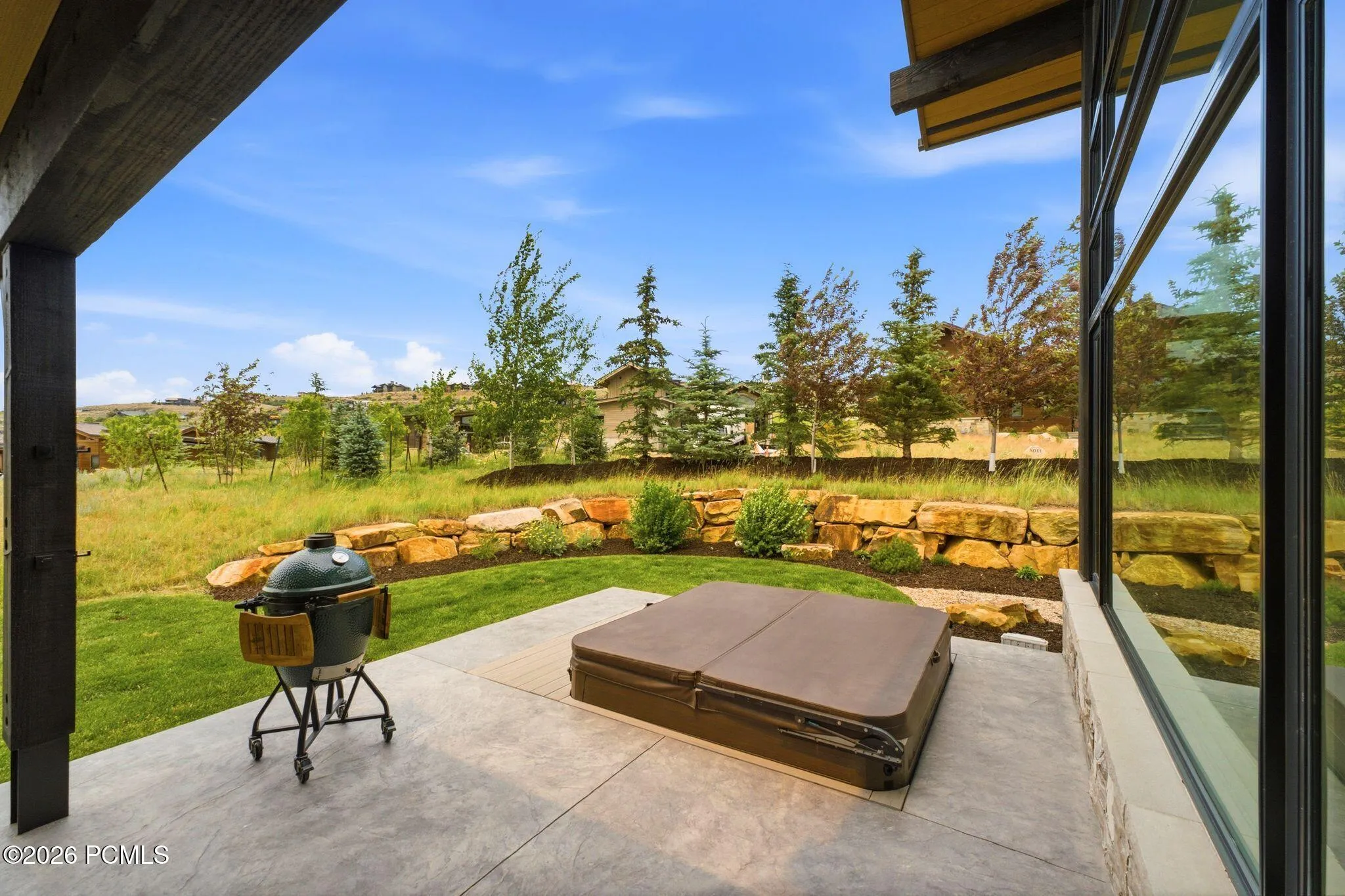 Patio and hot tub with views
