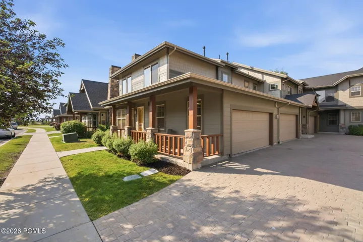 Fox Point at Redstone community exterior with two-car garage and heated driveway — HOA covers snow removal to your front door in this Park City townhome community.