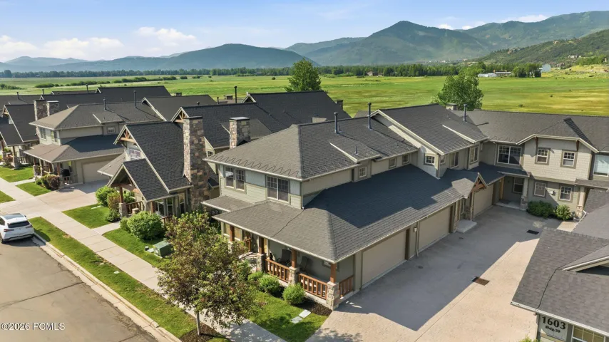 Aerial drone view of Fox Point at Redstone townhome community — Park City, UT location with mountain backdrop, trail access, and walkability to restaurants and entertainment.