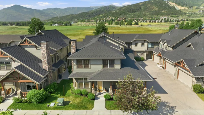 Community aerial view of Fox Point at Redstone — Park City townhome complex with green spaces, mature trees, and mountain surroundings just minutes from I-80.