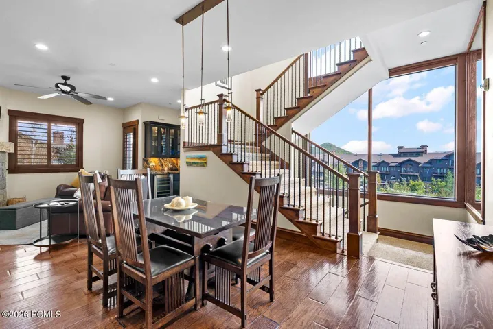 Dining and Living Area with Stairway and Large Window View