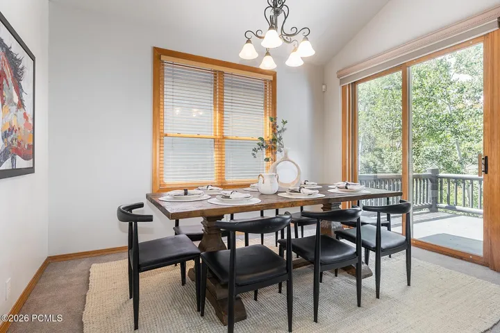 Beautiful dining room offers an inviting setting for memorable meals, with effortless access for dining indoors or stepping out to enjoy the surrounding outdoor spaces.
