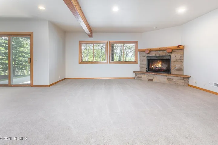 Expansive walkout lower level offers flexible space for a second living area, game room, fitness space, or effortless indoor-outdoor entertaining.