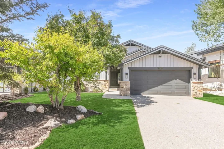 Step inside to an impressive open floor plan that lives beautifully, featuring three bedrooms on the main level and thoughtful separation from the primary suite for added privacy and comfort.