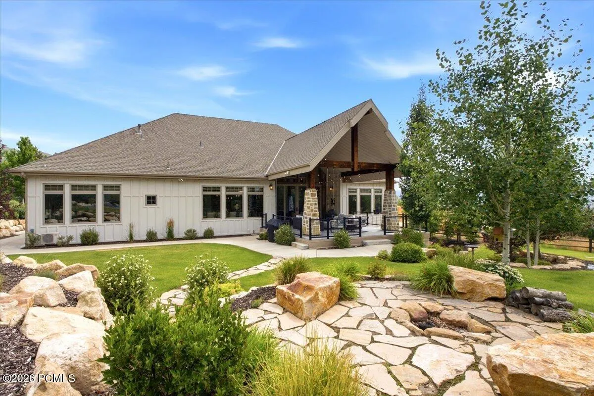 Expansive backyard featuring a fire pit