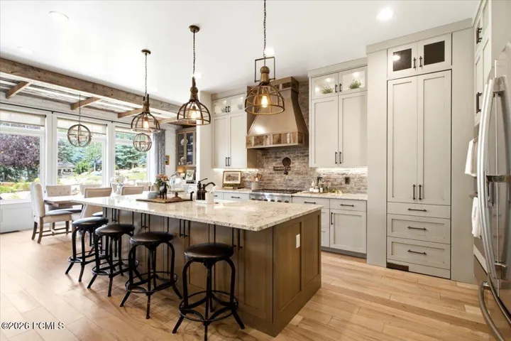 Kitchen featuring a spacious island and a hidden pantry