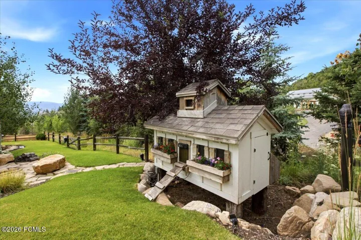 Charming chicken coop featuring flower boxes