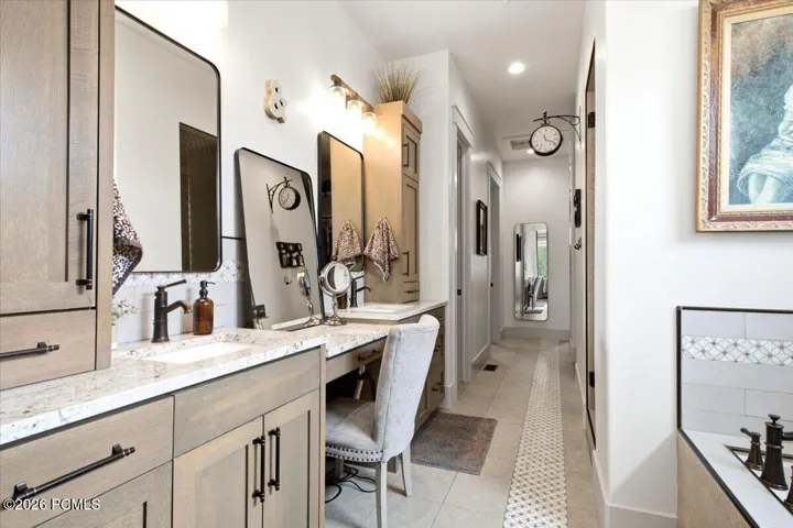 Owner's suite featuring a double vanity