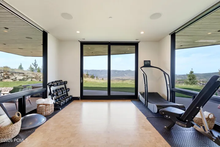 Glass wall mountain view exercise room
