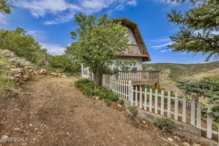 Two large mature trees, and extra parking next to cabin.
