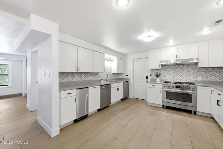 Two dishwashers and a trash compactor