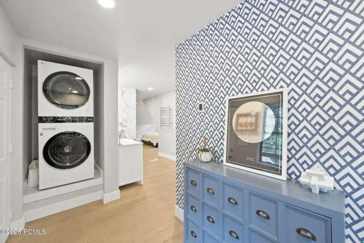 Primary suite laundry and dressing area