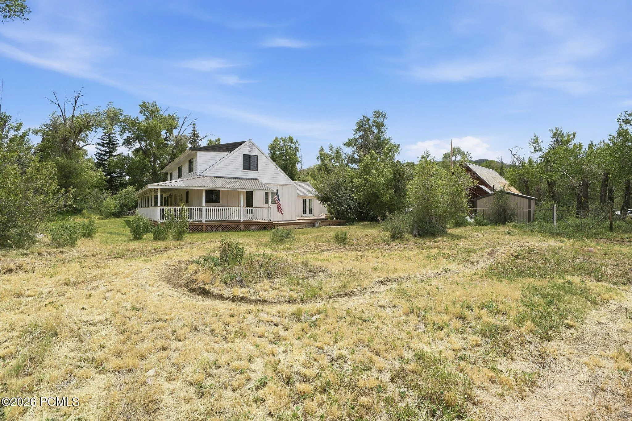 Motorcycle/pump track on additional lot included with home