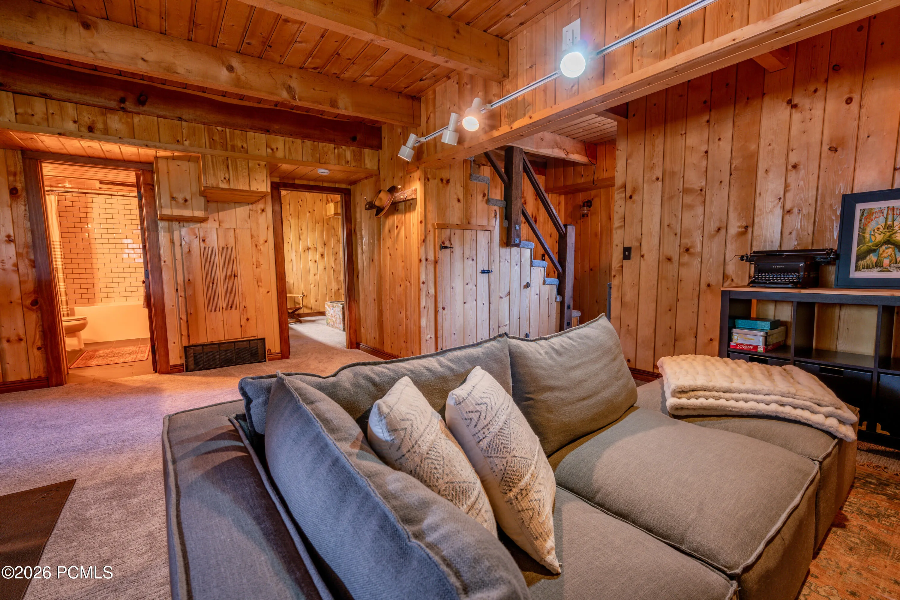 Family room with view to bathroom and bedroom entrances.