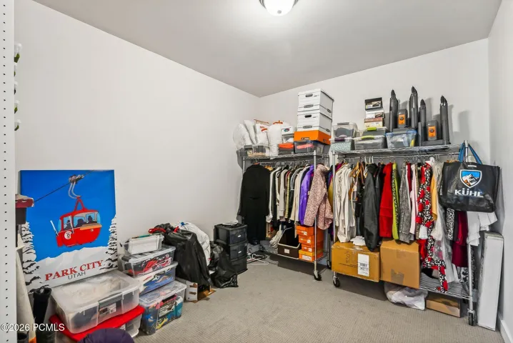 Finished lower level Storage with flexible use, which other owners have opened up to accomodate extra sleeping area - see next AI photo...