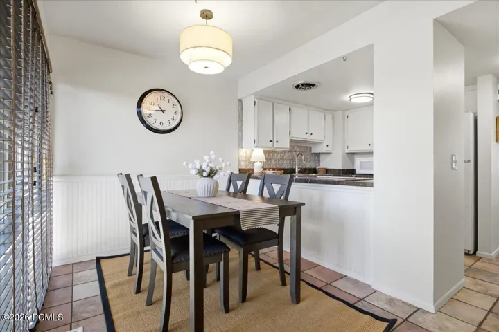 Open dining space features a pass-through counter to the kitchen.