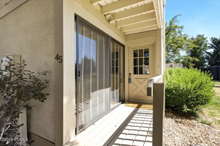 A private front entrance & covered porch welcomes you to 45 Spaulding Court.
