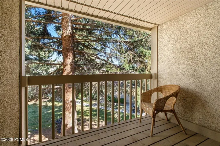 Secluded upper balcony with tree lined views.