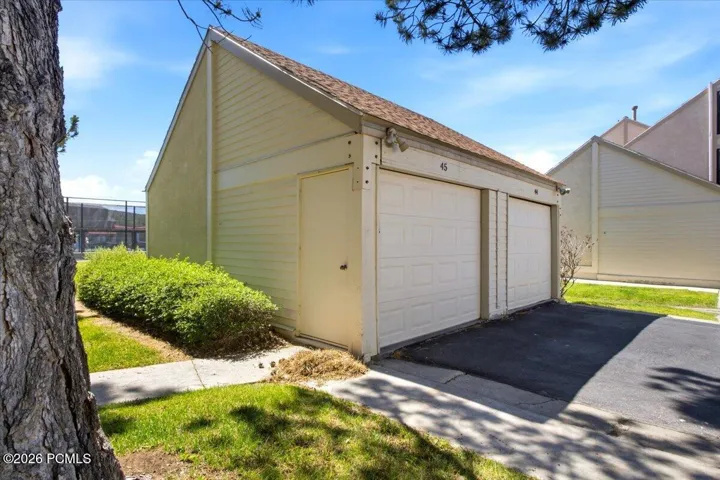 Dedicated detached one-car garage provides secure vehicle parking along with extra storage space for skis, bikes, and outdoor gear.