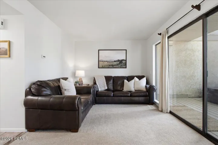 Spacious living room opens directly to the back deck and private hot tub.