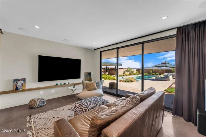 Flex Room with pocket doors leading to the pool and spa area