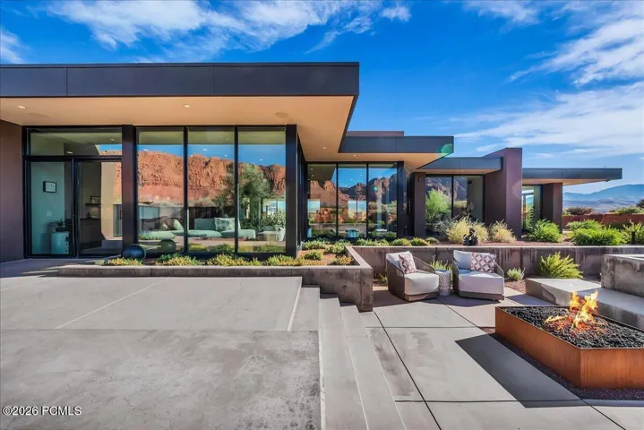 Outdoor lounge area with built in fire pit off of the main kitchen area