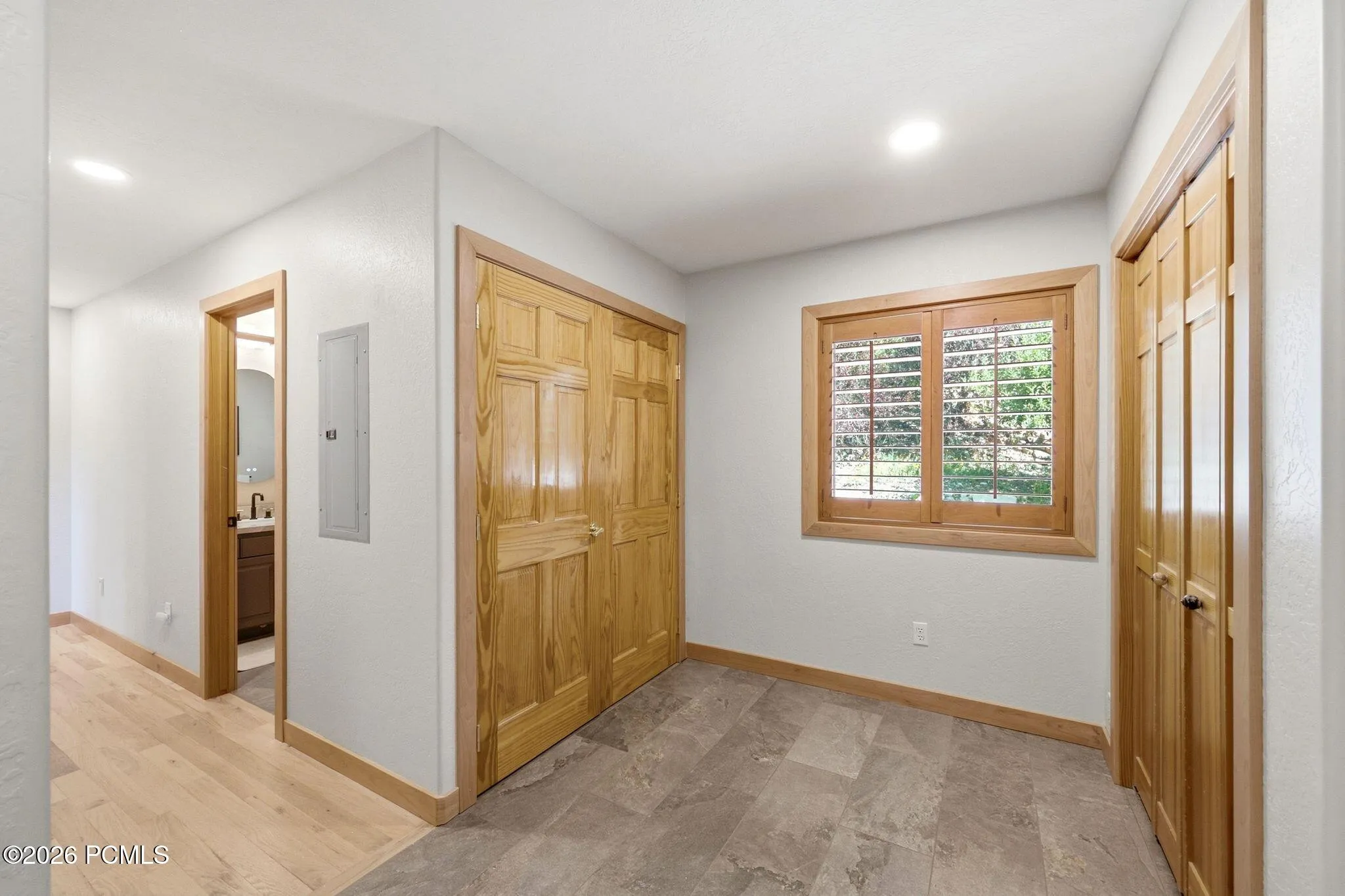 Mudroom with ample storage and heated floors right off of the garage entrance into the home.