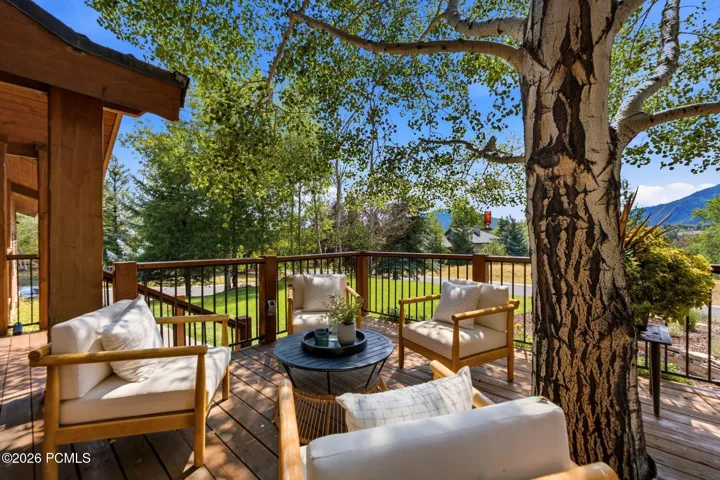 Front deck with a tree integrated into the deck and stunning views of Park City, Canyons, and Deer Valley. Imagine watching the fireworks from your front deck!