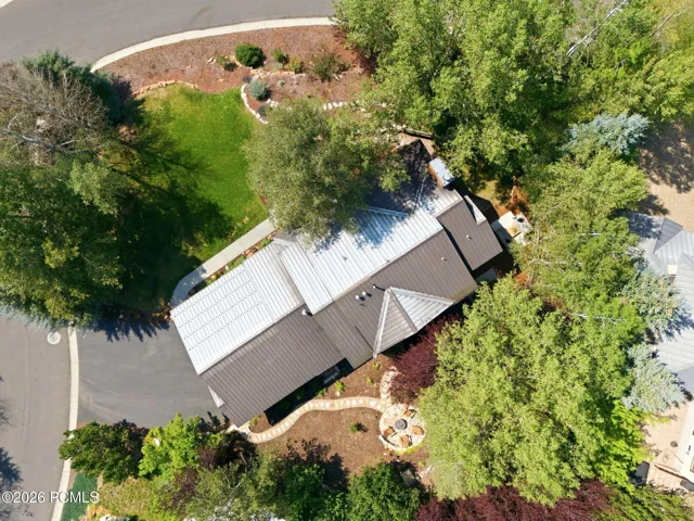 Well maintained wood siding and a 70 year metal roof. 3 car garage with ample storage and additional off-street driveway parking. The lot is covered with mature trees without obstructing your view of the mountains.