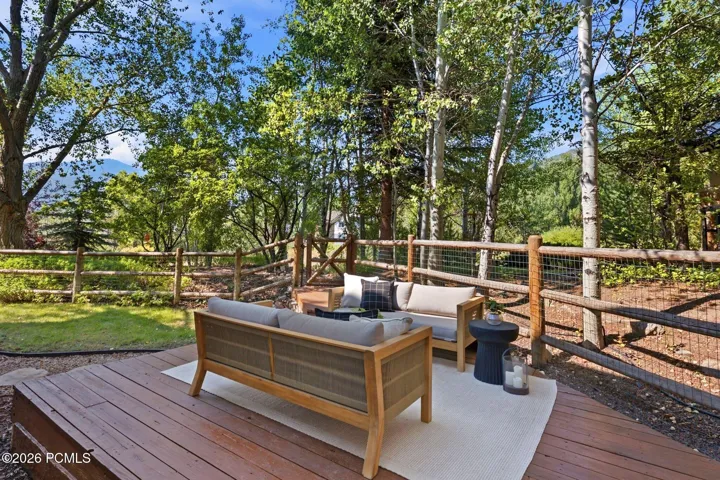 Secluded and private back deck right off the kitchen and dining room with multiple seating areas for entertaining, relaxing, working from home, and being immersed in nature. The home often sees moose, deer, rabbits, squirrels, birds and less commonly elk, bobcats, fox and raccoons