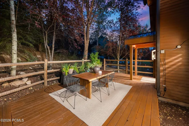 Secluded and private back deck right off the kitchen and dining room with multiple seating areas for entertaining, relaxing, working from home, and being immersed in nature. The home often sees moose, deer, rabbits, squirrels, birds and less commonly elk, bobcats, fox and raccoons