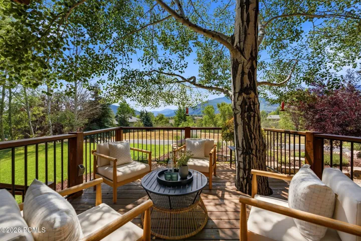 Front deck with a tree integrated into the deck and stunning views of Park City, Canyons, and Deer Valley. Imagine watching the fireworks from your front deck!