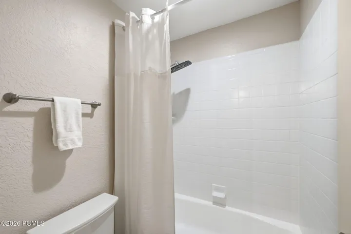 Tub/shower combination, with heated flooring and updated fixtures.