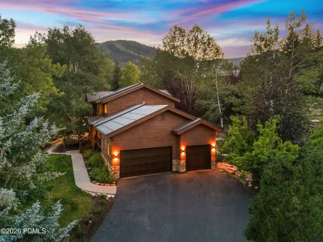 Well maintained wood siding and a 70 year metal roof. 3 car garage with ample storage and additional off-street driveway parking.
