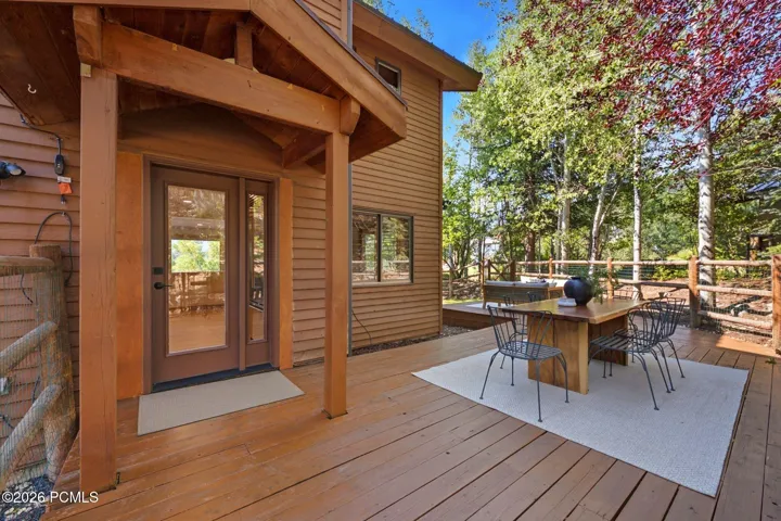 Secluded and private back deck right off the kitchen and dining room with multiple seating areas for entertaining, relaxing, working from home, and being immersed in nature. The home often sees moose, deer, rabbits, squirrels, birds and less commonly elk, bobcats, fox and raccoons